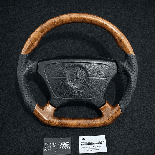 Mercedes-Benz sport steering wheel with Burl Wood and a flat-bottom design, compatible with W124, W140, and R129 models.