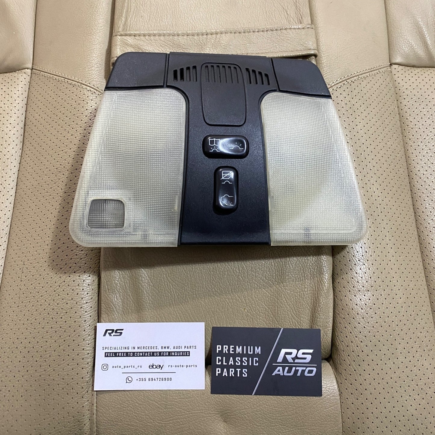 Genuine Mercedes-Benz overhead dome light console in black for W210, W202, and W208, part A2108202901.