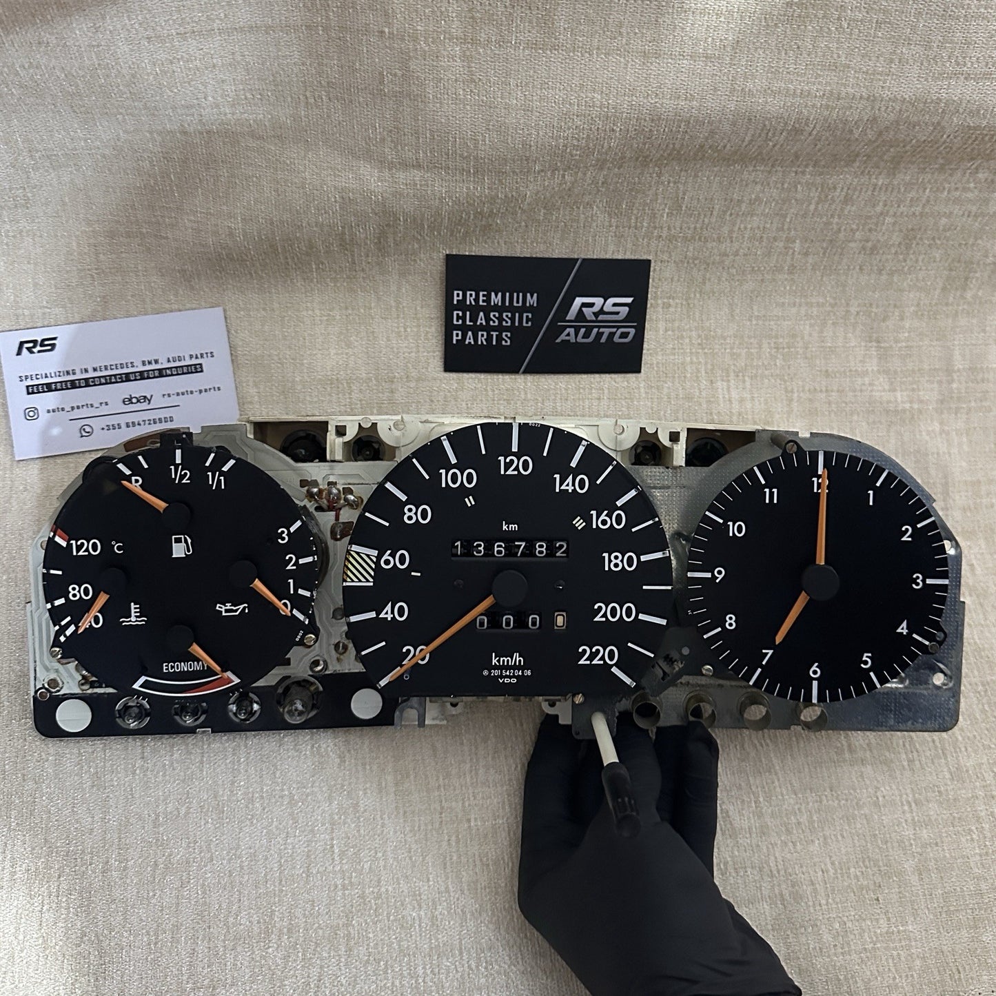 Internal 3-piece gauge set for Mercedes W201 190E, includes speedometer, clock, and multi-indicator gauge, OEM VDO parts.