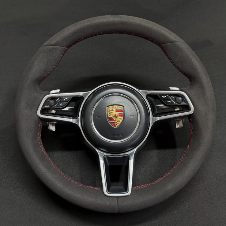 Custom Porsche steering wheel wrapped in Alcantara with red stitching
