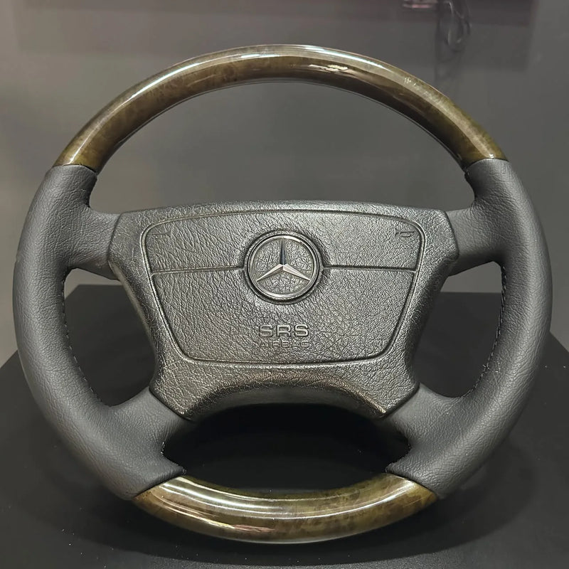 Refurbished Mercedes W124 and W210 steering wheel with bird's eye maple wood and black leather