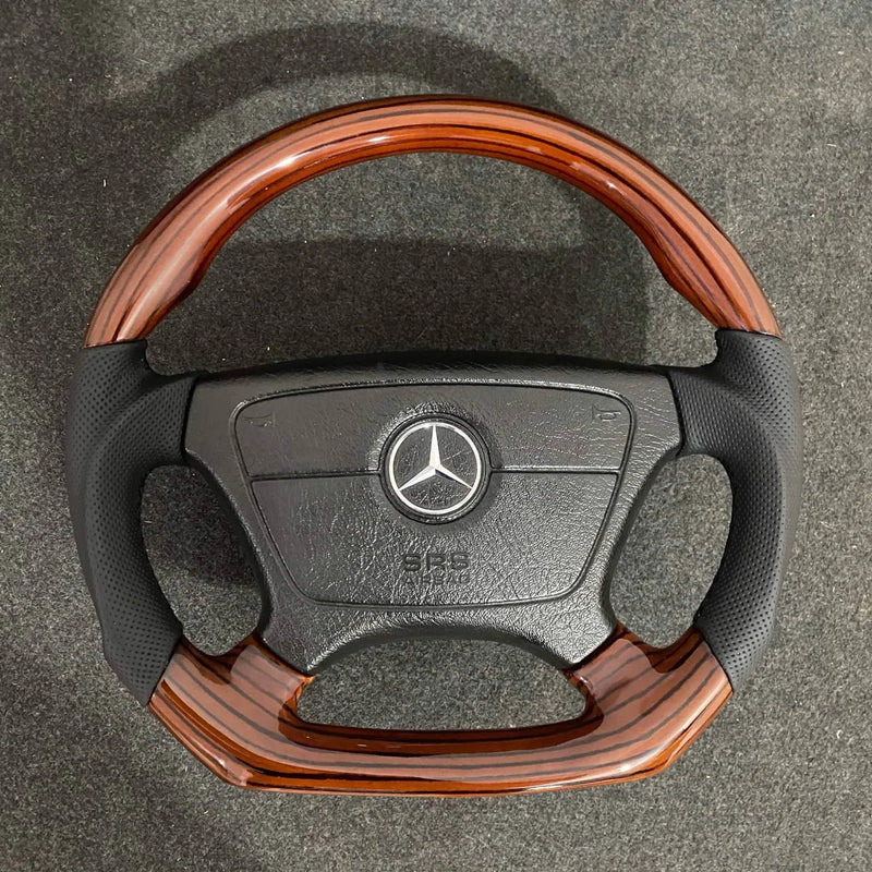 Custom flat-bottom Mercedes R129 and W201 steering wheel in zebrano wood with perforated leather