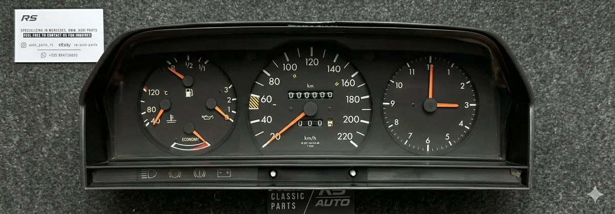 Mercedes-Benz W124 instrument cluster after restoration: refinished needles and clean gauge faces