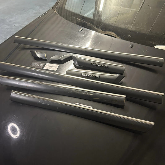 Complete 6-piece Mercedes-Benz W202 Elegance exterior trim set, chrome door mouldings.